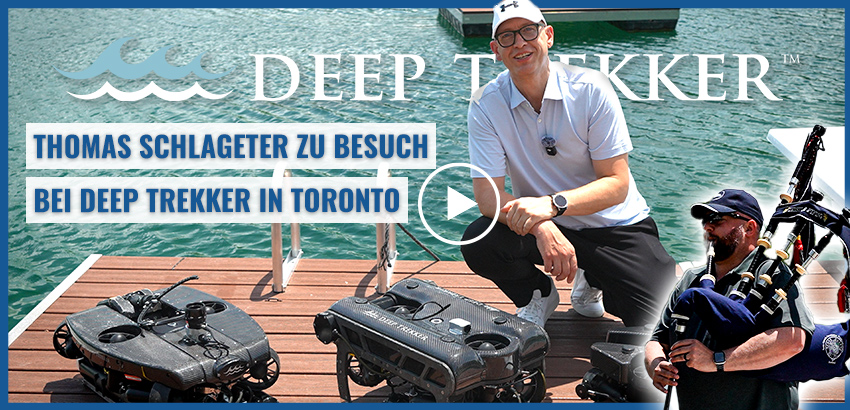 Ein Mann kniet auf einem Steg neben zwei Unterwasser-Roboterfahrzeugen. Text: „Thomas Schlageter zu Besuch bei Deep Trekker in Toronto“.